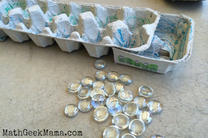 Create your own Mancala game out of an egg carton! A great way for kids to learn math and strategy through play! 