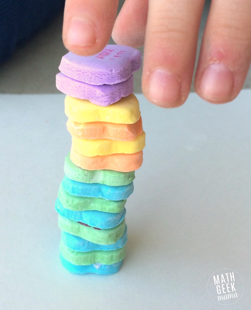 This simple challenge lets kids explore engineering and math, as well as work on fine motor skills! All you need is a bag of conversation hearts for hours of math fun and learning!